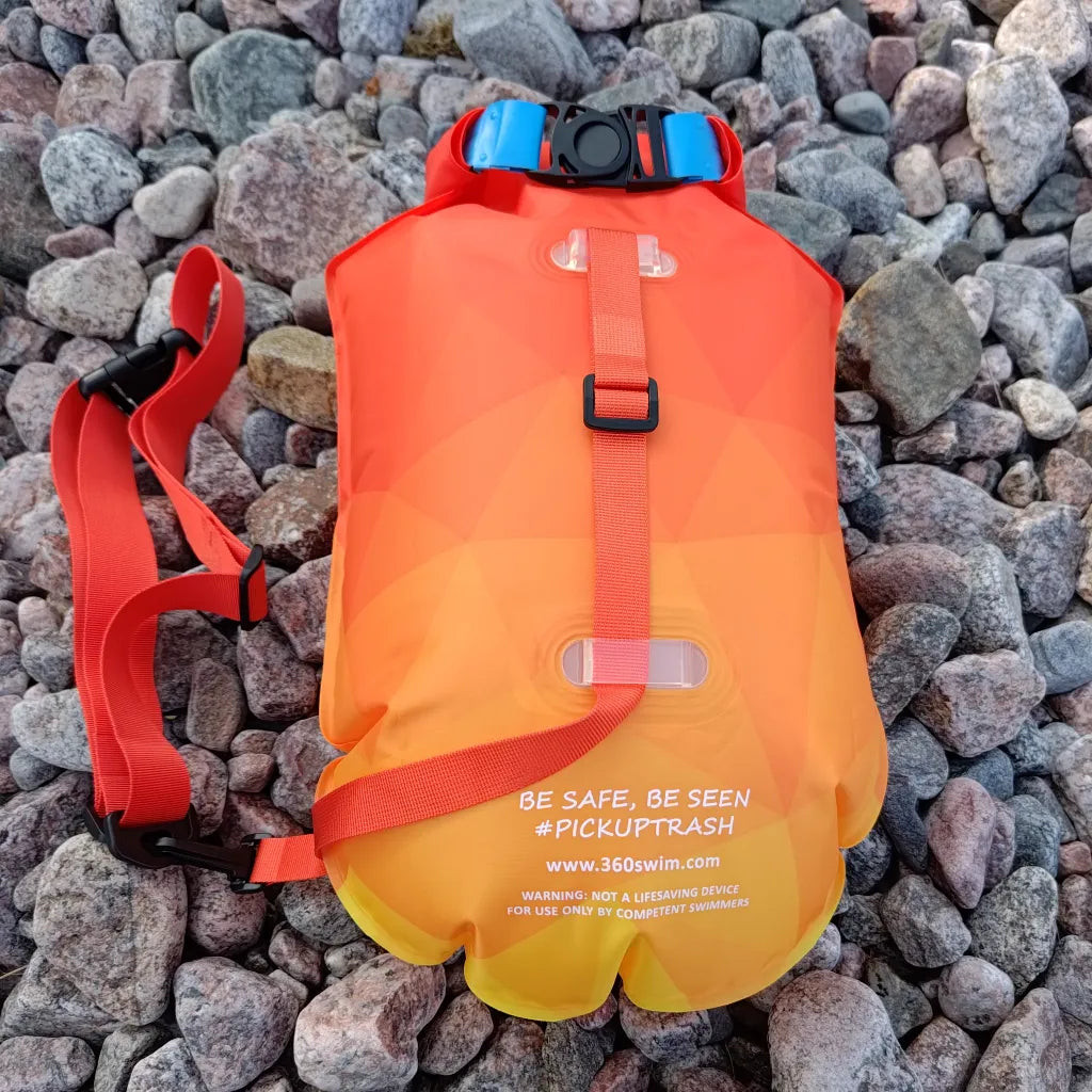 Back side of Sunflare swim buoy with drybag and waist belt for open water visibility