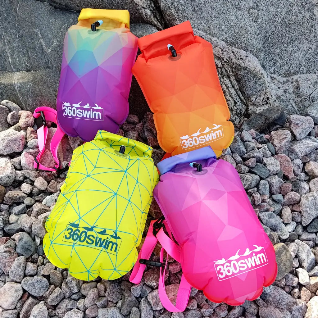 All four Ultra Dazzle swim buoys with gradient color designs - Sunflare, Twilight Bloom, Electric Coral, and Lemon Wire