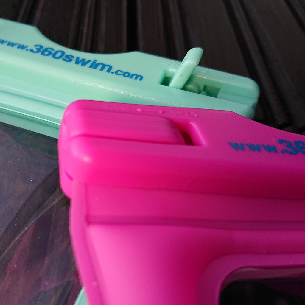 Funda de móvil turquesa y rosa con cierre