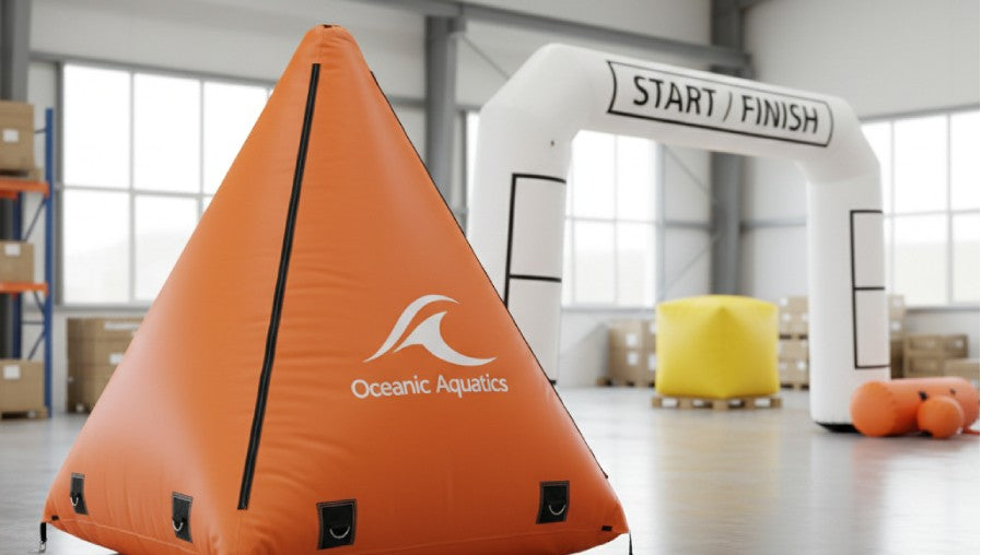 Example of custom inflatable swim course marker and start/finish gate in production setting.