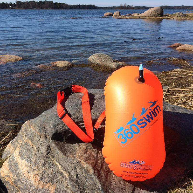 orange tow float by the sea