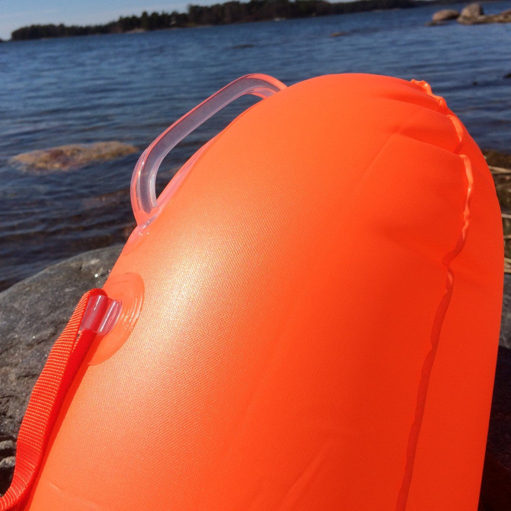 orange tow float with a handle for safety