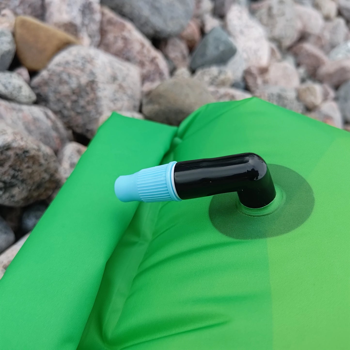 Close-up of inflation valve on green 360swim Ultra Dazzle swim buoy