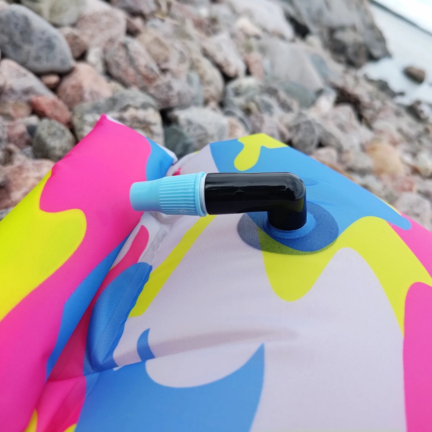 Close-up of inflation valve on urban camouflage 360swim Ultra Dazzle swim buoy